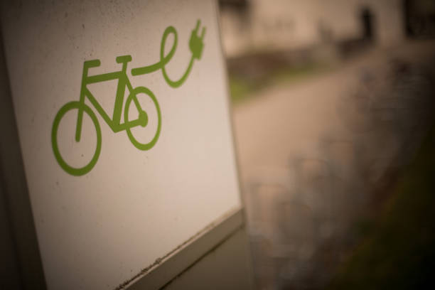 Close up shot of an electrical bike charging station sign with shallow depth of field.