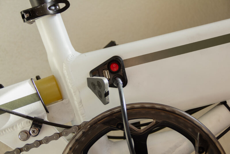 Close up of an electric bike charging. Concept of sustainability and ecology.